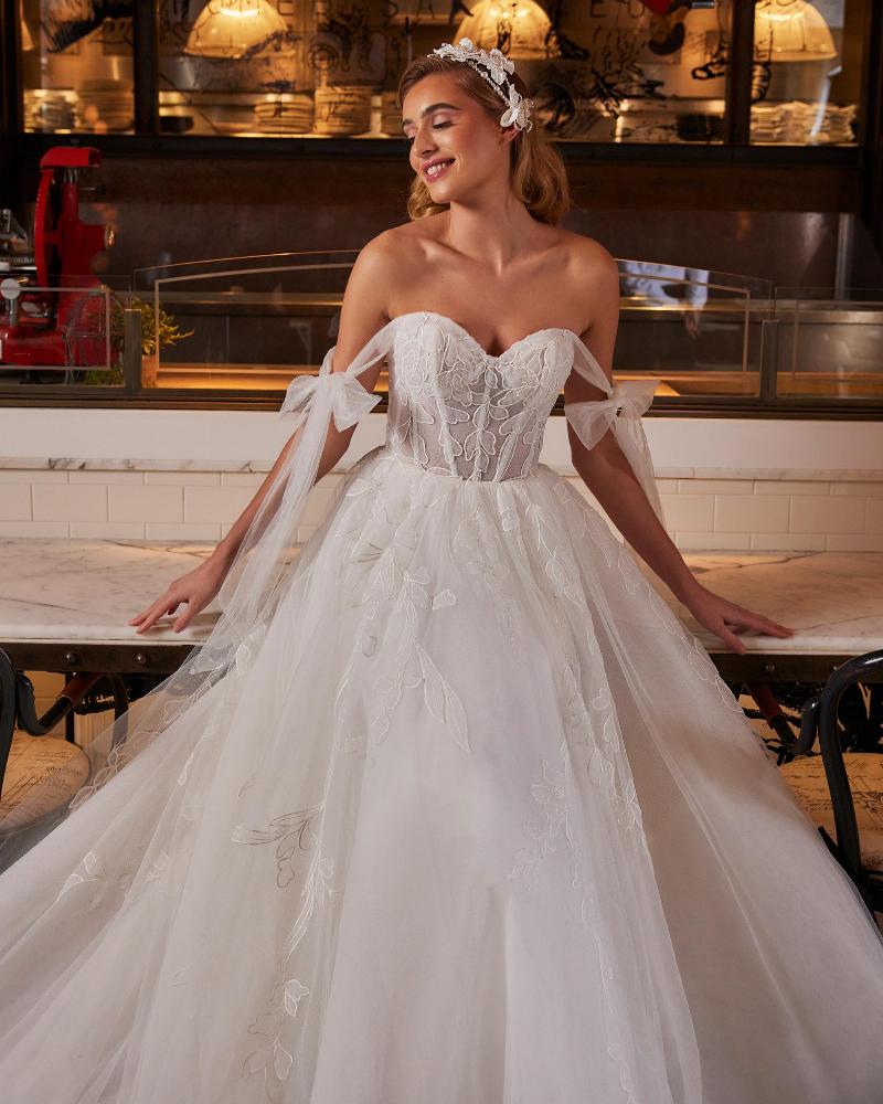 La22237 off the shoulder ball gown wedding dress with long train and lace1